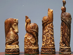 A beautifully hand-carved set of camel bone chessmen. 