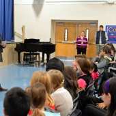 Tony Award winner Roger Bart, left, speaking Monday to students at the Norwood Public School.